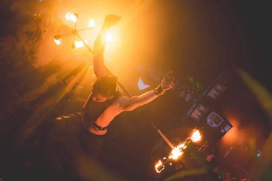 festivals in costa rica-37 | Pacific Photography Fire dancer performing with flaming torches in a dark, smoky setting.