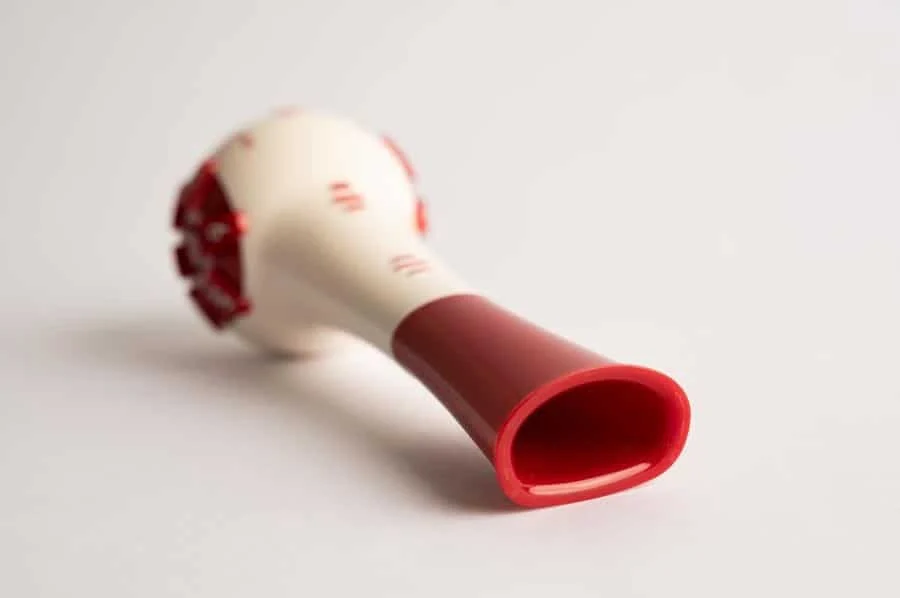 product photography costa rica -13 | Pacific Photography White bulb syringe with a red hollow tip, a medical suction device used to clear passages or apply fluids.
